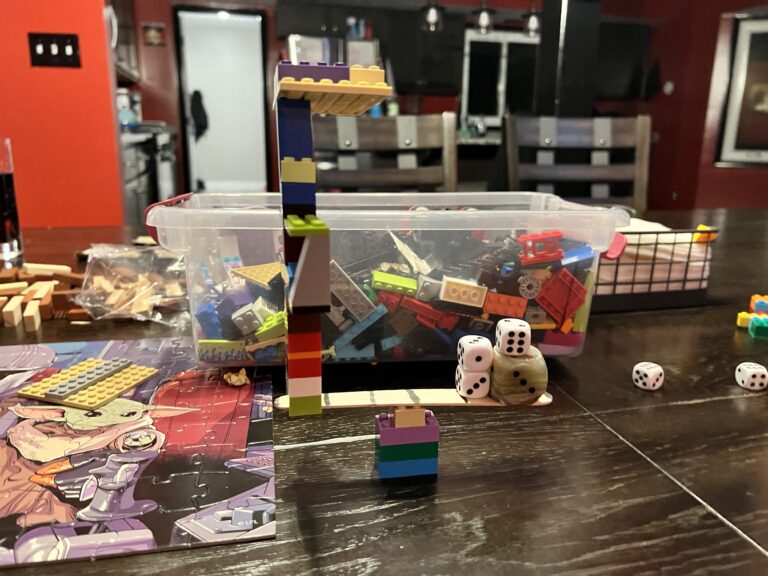 Weighing the Odds: Finding the Perfect Balance Between Dice and Legos on Popsicle Sticks